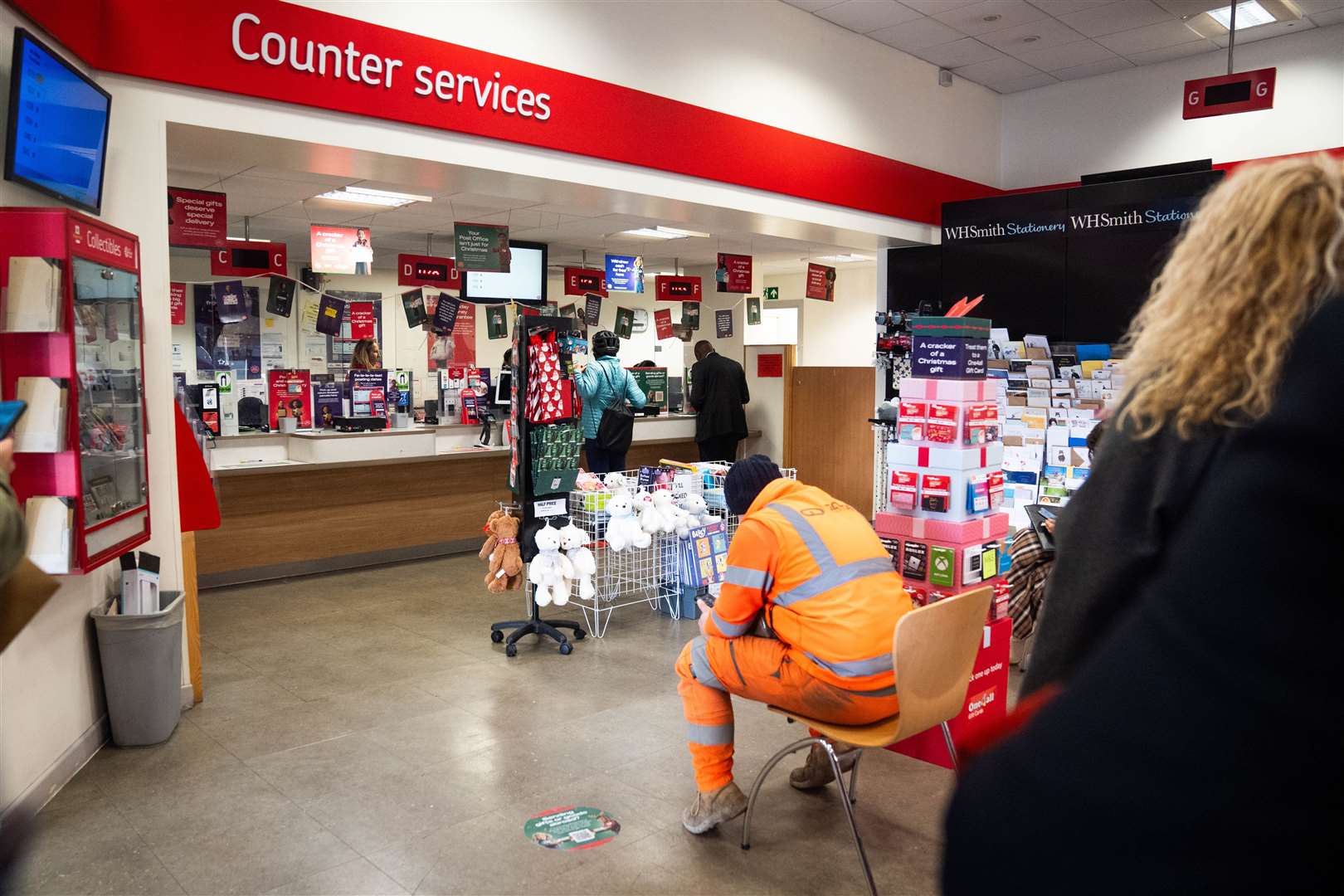 People inside a branch of the Post Office in Paddington, London (James Manning/PA)