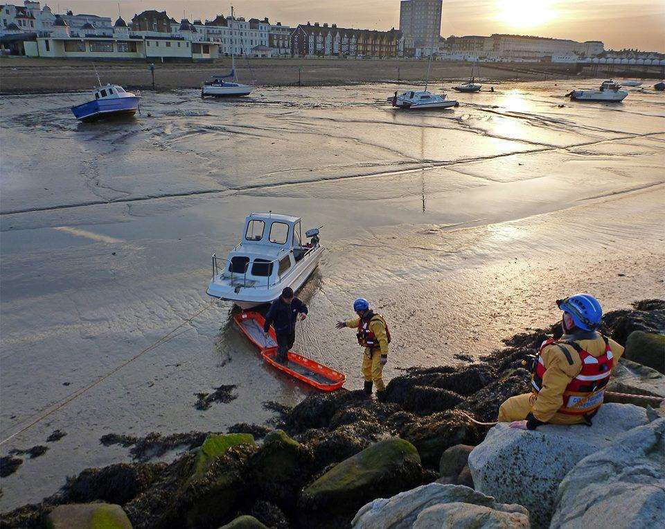 The boy was rescued from mud. Stock image.