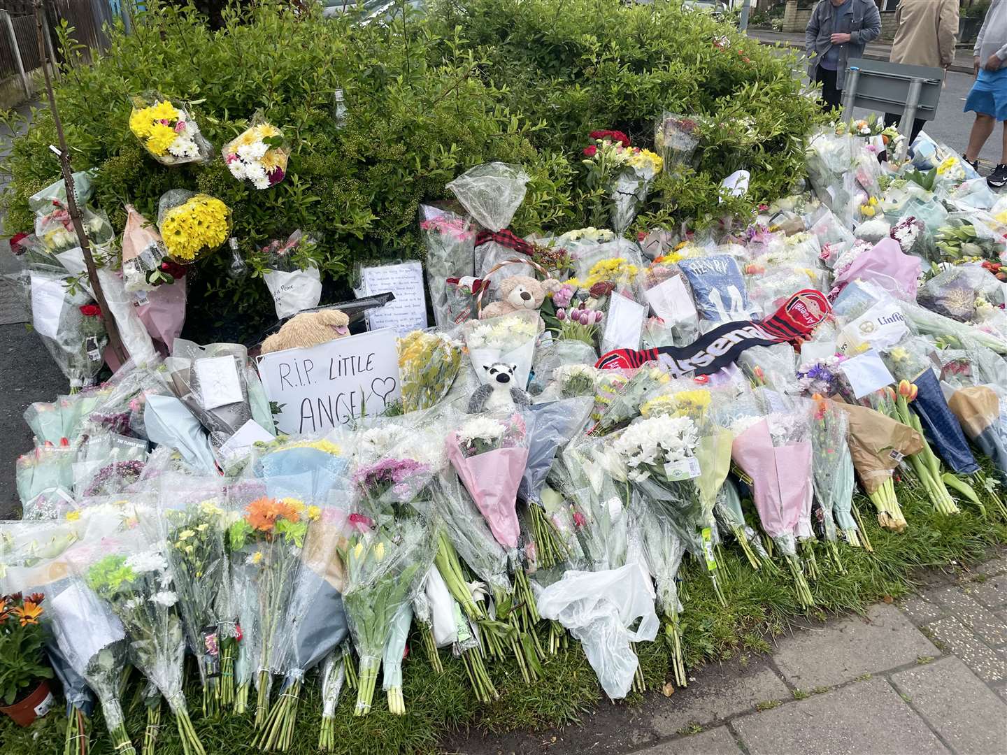 Floral tributes to Daniel Anjorin at the end of Laing Close in Hainault (Samuel Montgomery/PA)