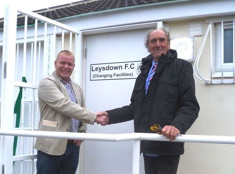 Leysdown FC manager Charlie Osmond with Cllr Purssord outside the, then, new changing rooms