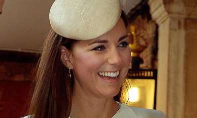 The Duke and Duchess of Cambridge with Prince George at his christening. Picture: John Stillwell/PA