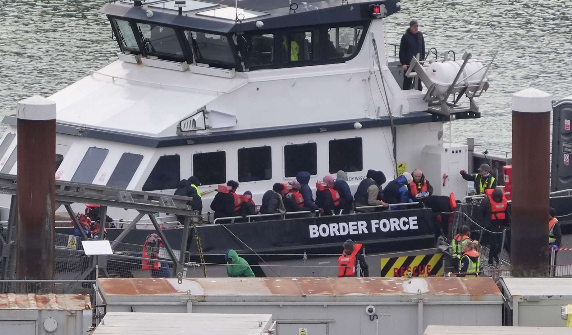 A group of people thought to be migrants are brought in to Dover, Kent, from a Border Force vessel following a small boat incident in the Channel (Gareth Fuller/PA)