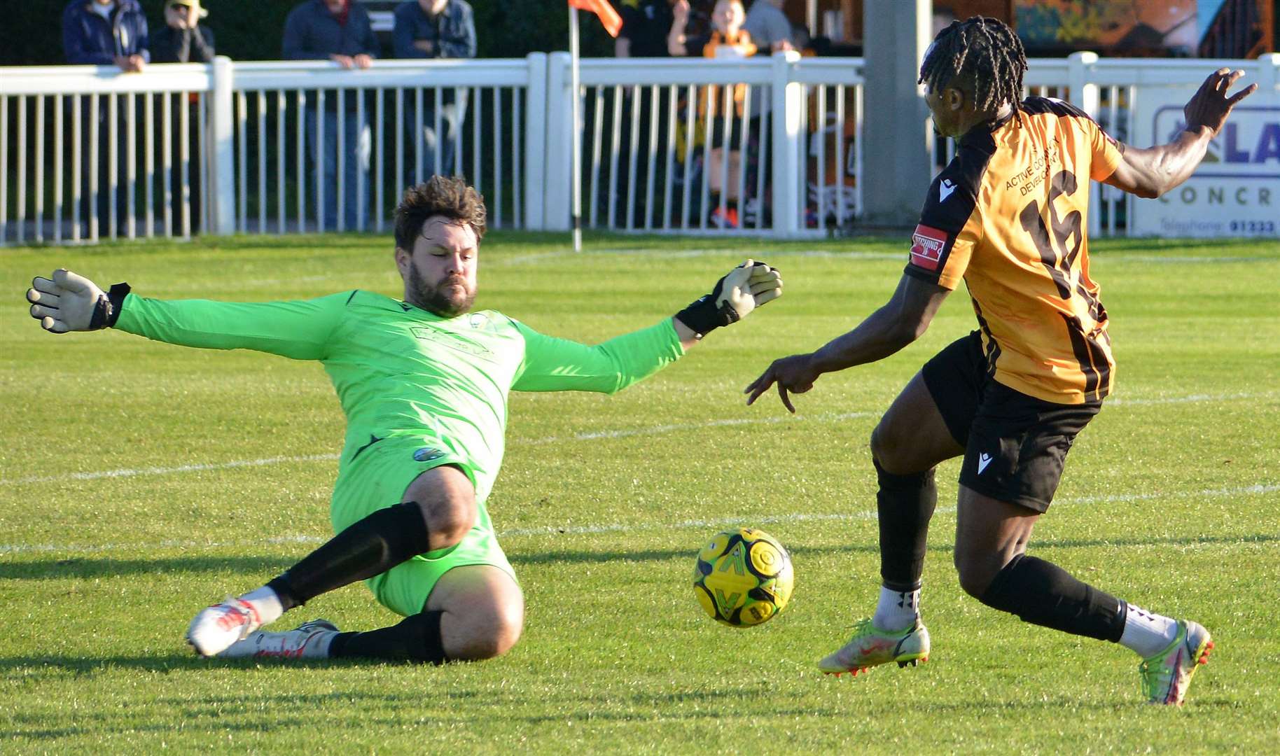 Two-goal Folkestone substitute Evans Kouassi comes up against Ascot United keeper Mark Scott. Picture: Randolph File