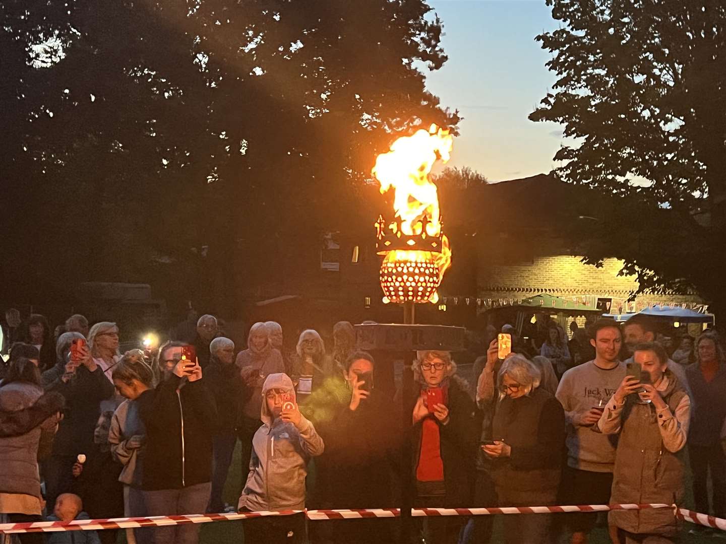 People gathered around to see the beacon be lit in the village of Vigo