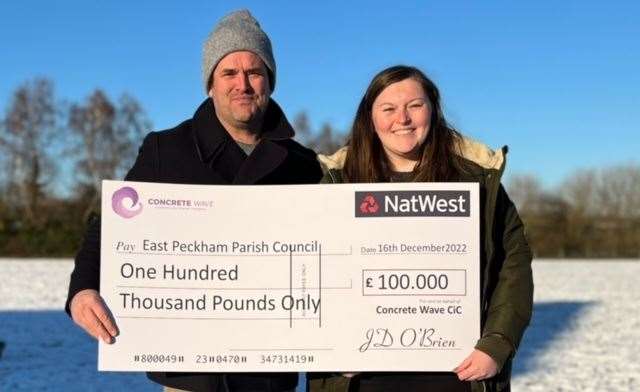 JD O'Brien and the then East Peckham parish clerk Emily Ellis with the £100k cheque