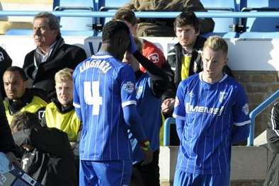 Amine Linganzi gets treatment for a head wound on Saturday