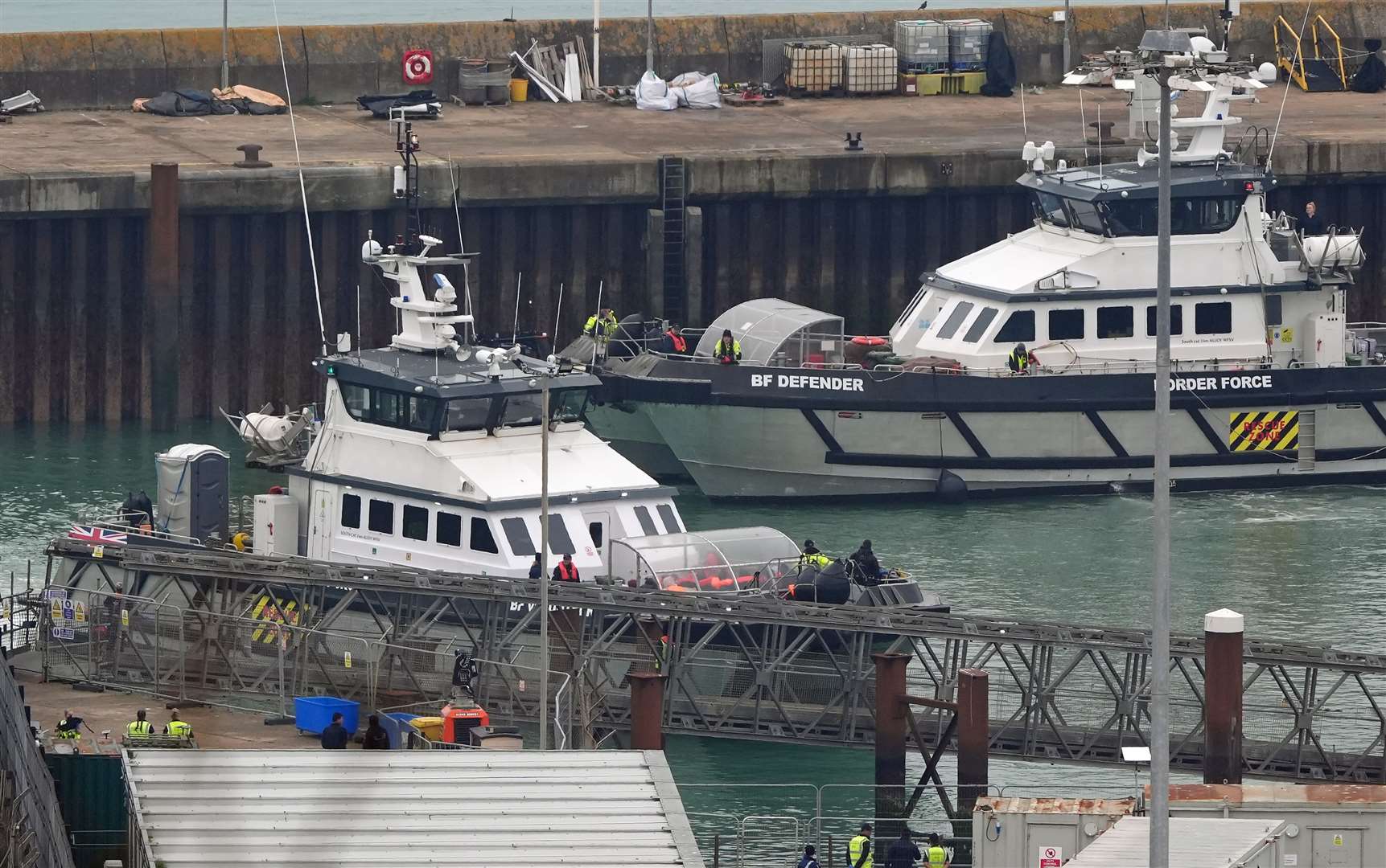 A group of people thought to be migrants are brought in to Dover, Kent, onboard a Border Force vessel following a small boat incident in the Channel (Gareth Fuller/PA)