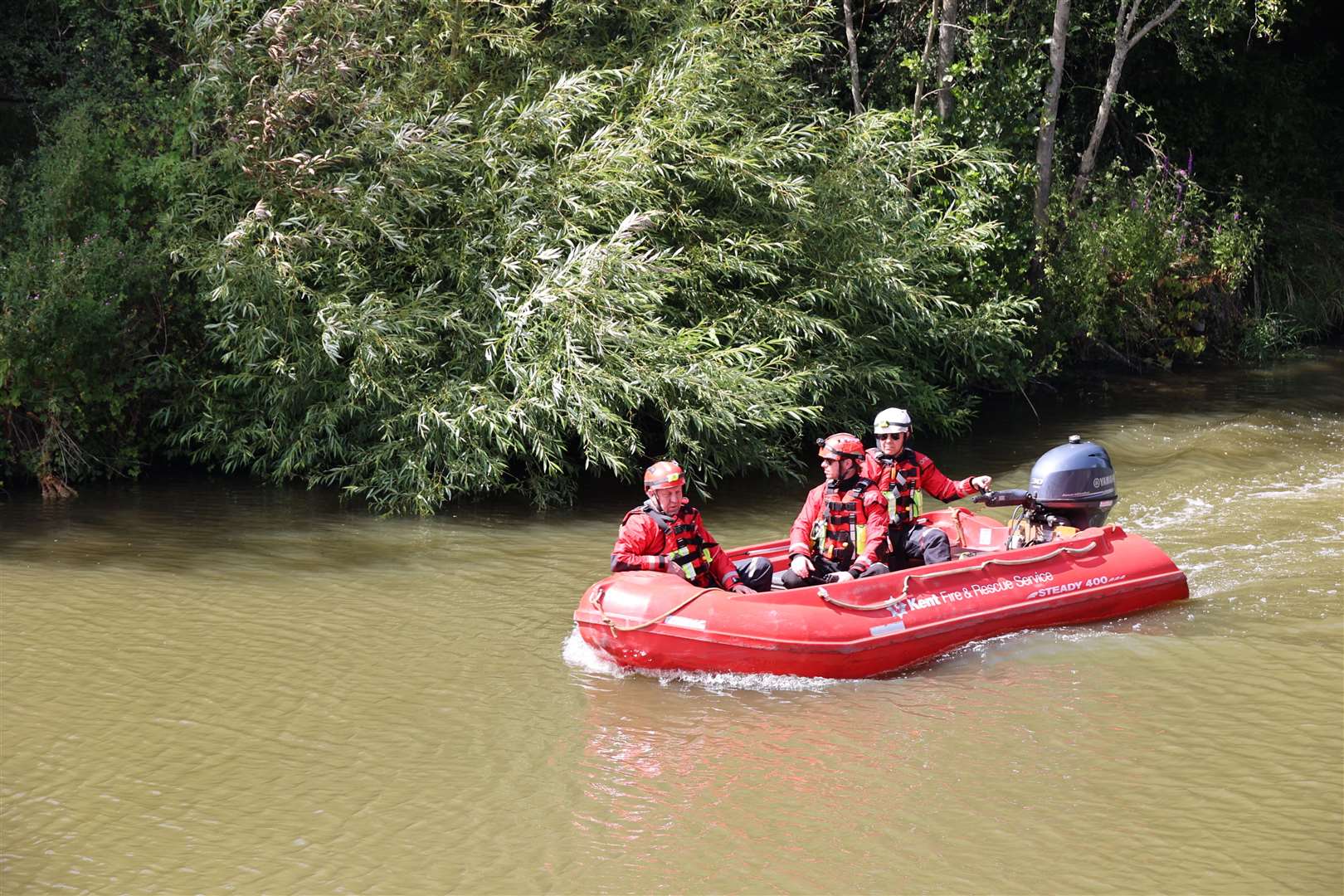 Fire crew on a boat. Picture: Bernard Snell