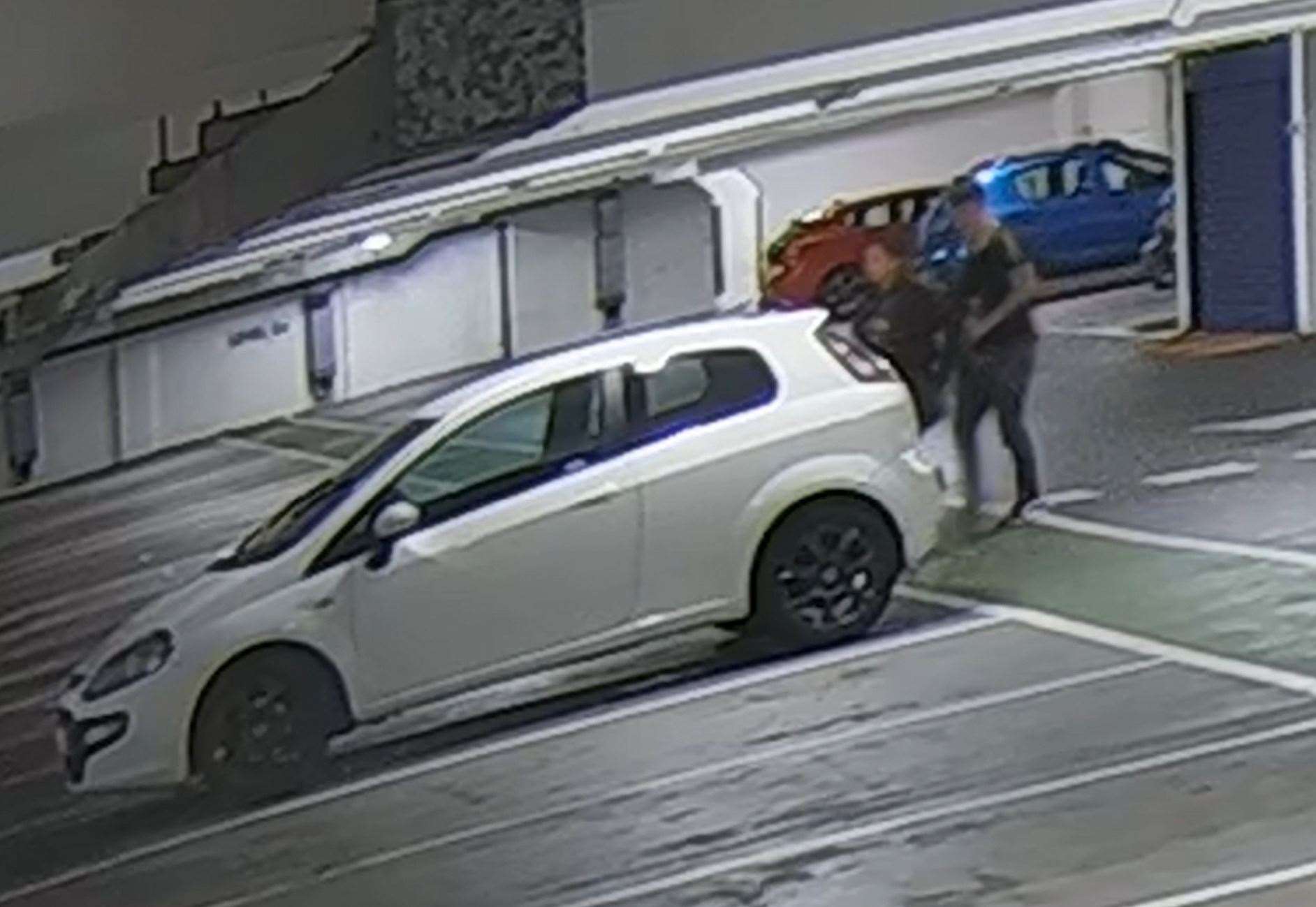 CCTV screengrab showing Alice Wood and Ryan Watson walking to his car (Cheshire Police)