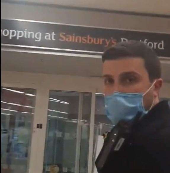 A police officer calmly escorts the woman off the premises in Sainsbury's Dartford. Photo: u/BurnedRope