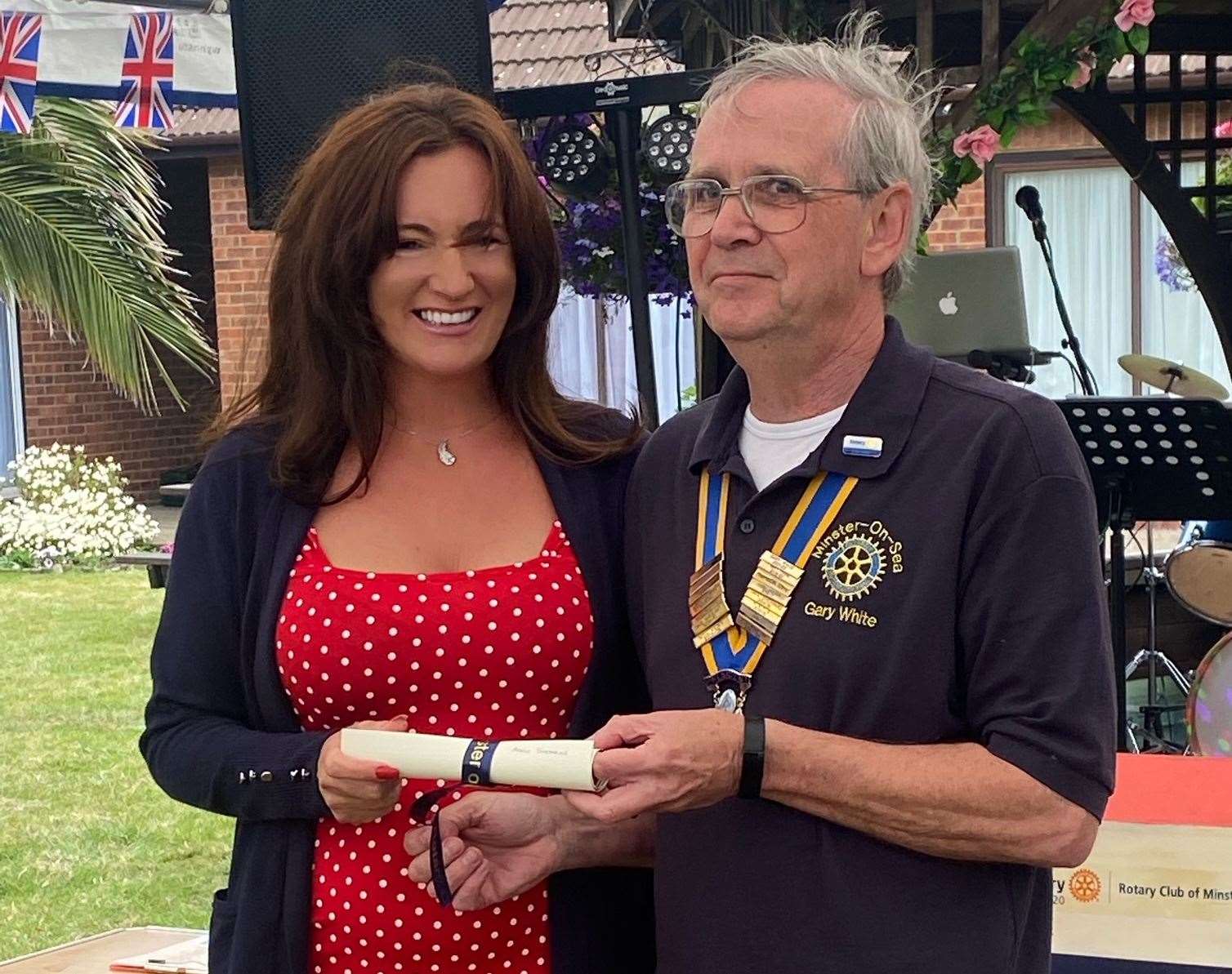 Adele Stearns with Minster-on-Sheppey Rotary Club president Gary White. She picked up a Platinum Jubilee award for her work looking after swans