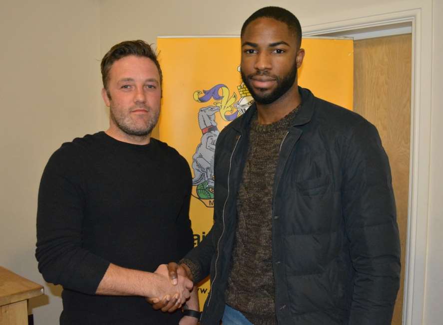 Maidstone United manager Jay Saunders welcomes Dumebi Damaka to the Gallagher