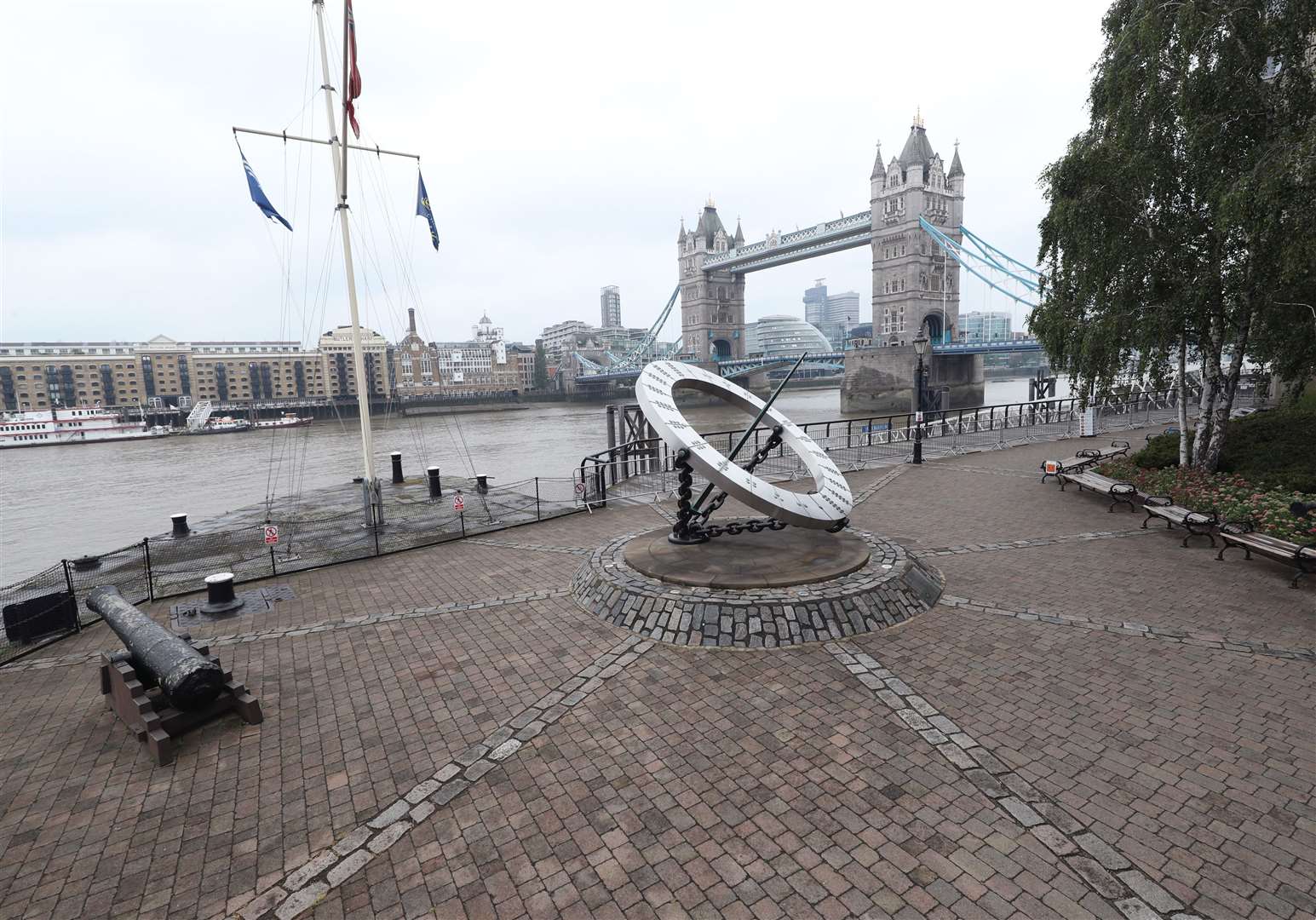 A popular riverside walk alongside the Thames near London’s Tower Bridge is deserted on a rainy Thursday midday… (Yui Mok/PA)