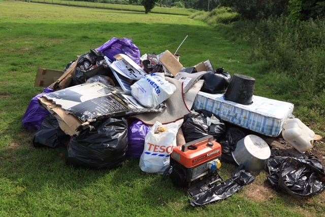 Rubbish accumulated after an illegal encampment. Ministers say allocated sites will relieve tensions.