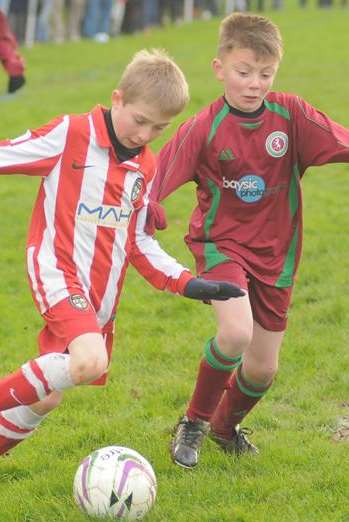 The under-11s of Strood United, red and white stripes, and Cobham Colts were also in League Cup action. Picture: Steve Crispe