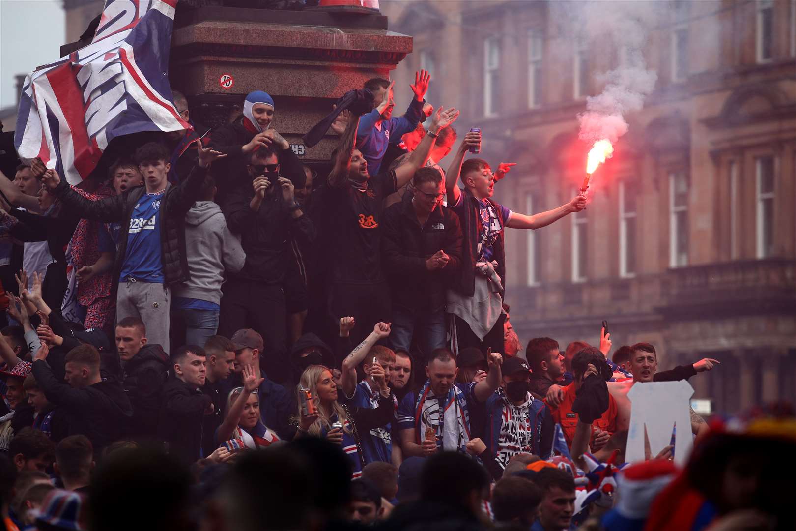 Rangers fans celebrate winning the Scottish Premiership in George Square (Andrew Milligan/PA)