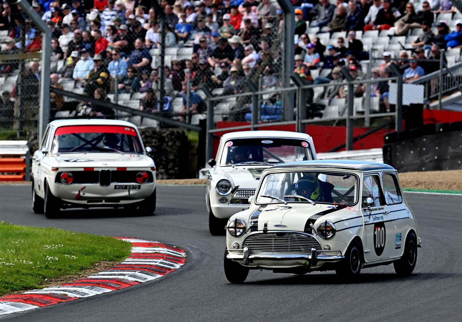 Ollie Streek, from Cranbrook, finished third in the up to 1,300cc class in the Pre-66 Touring Cars race, handling his 1965 Mini Cooper S. Picture: Simon Hildrew