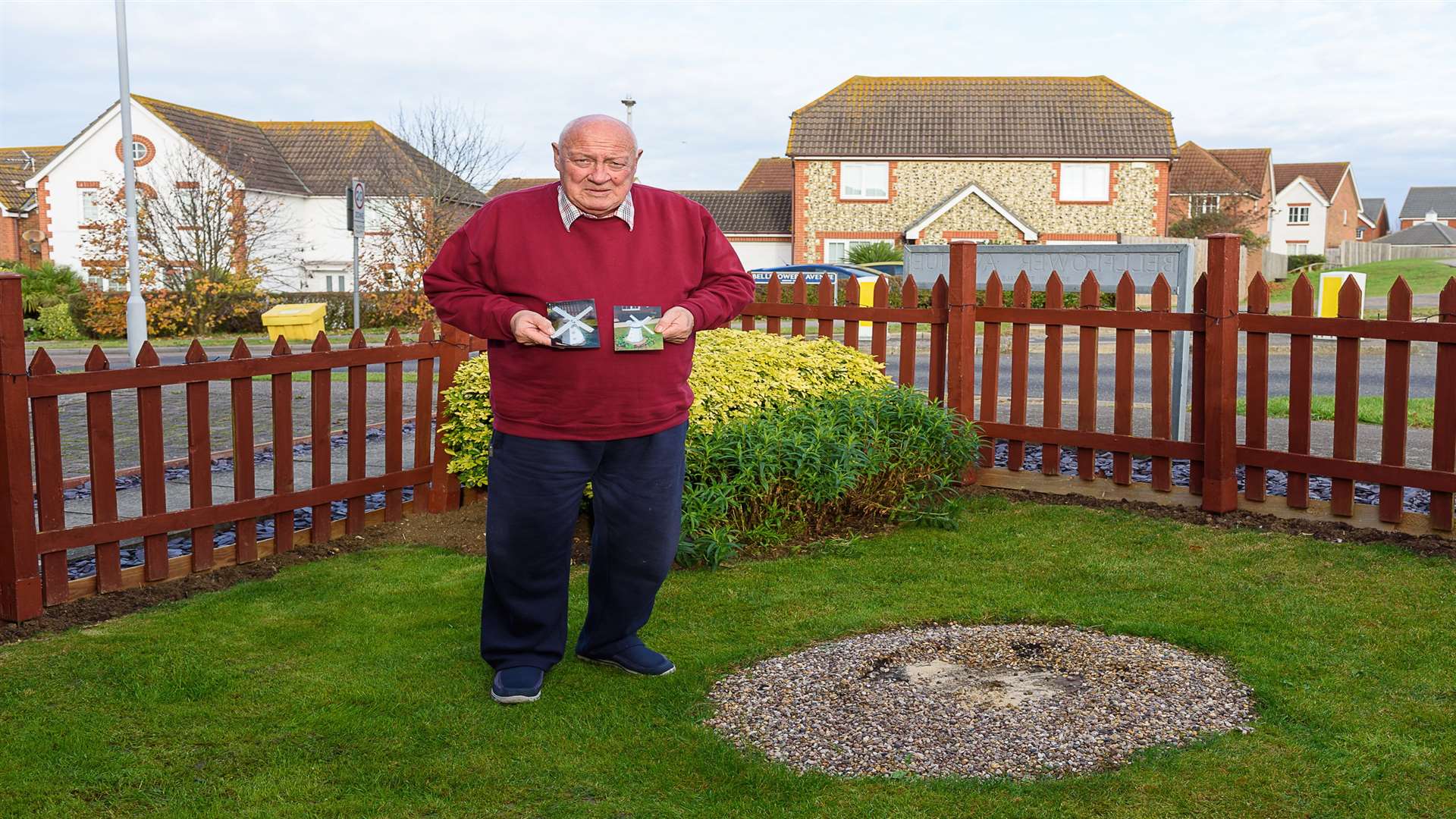 Maurice Hartigan with photographs of his stolen wooden windmill from his front garden in Minster, Sheppey