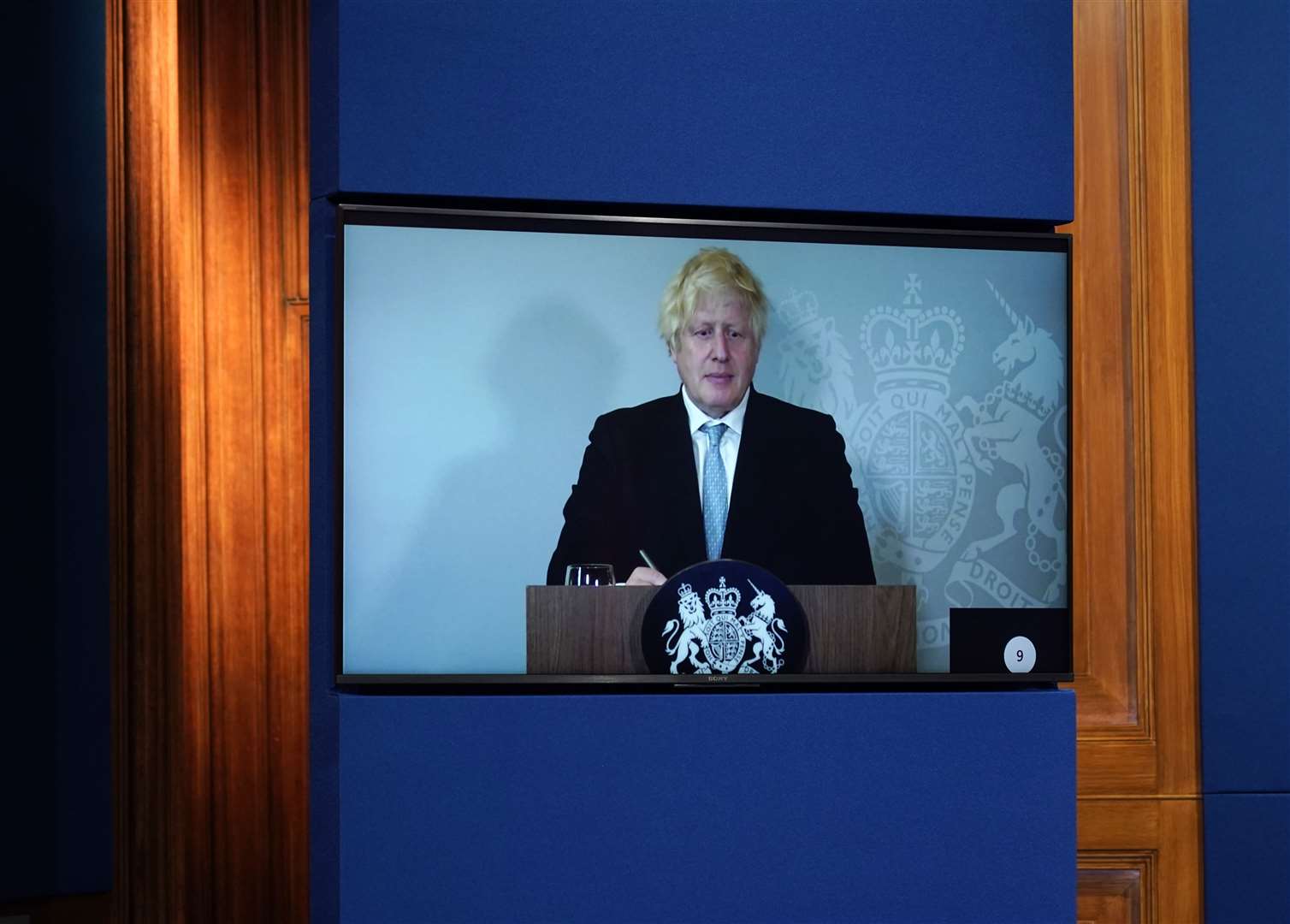 Prime Minister Boris Johnson appears on a screen from Chequers, where he is self-isolating (Alberto Pezzali/PA)