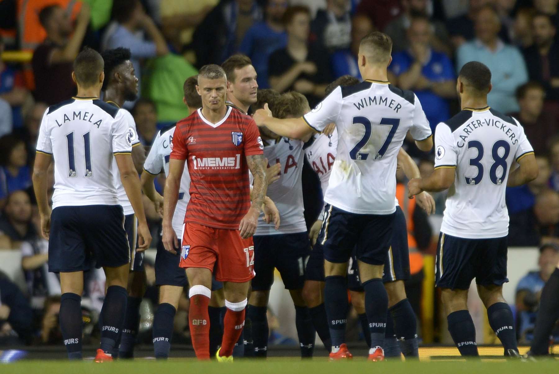 The hosts celebrate Christian Eriksen's opener before going on to add four more goals in the second half Picture: Barry Goodwin