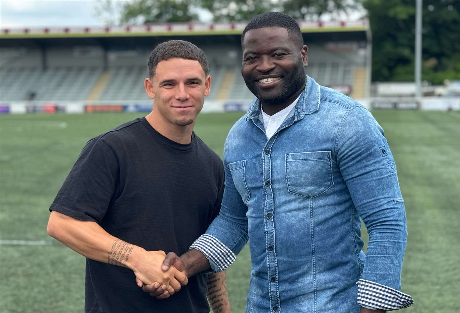 Maidstone United's new signing Charlie Seaman with boss George Elokobi Picture: Maidstone United FC