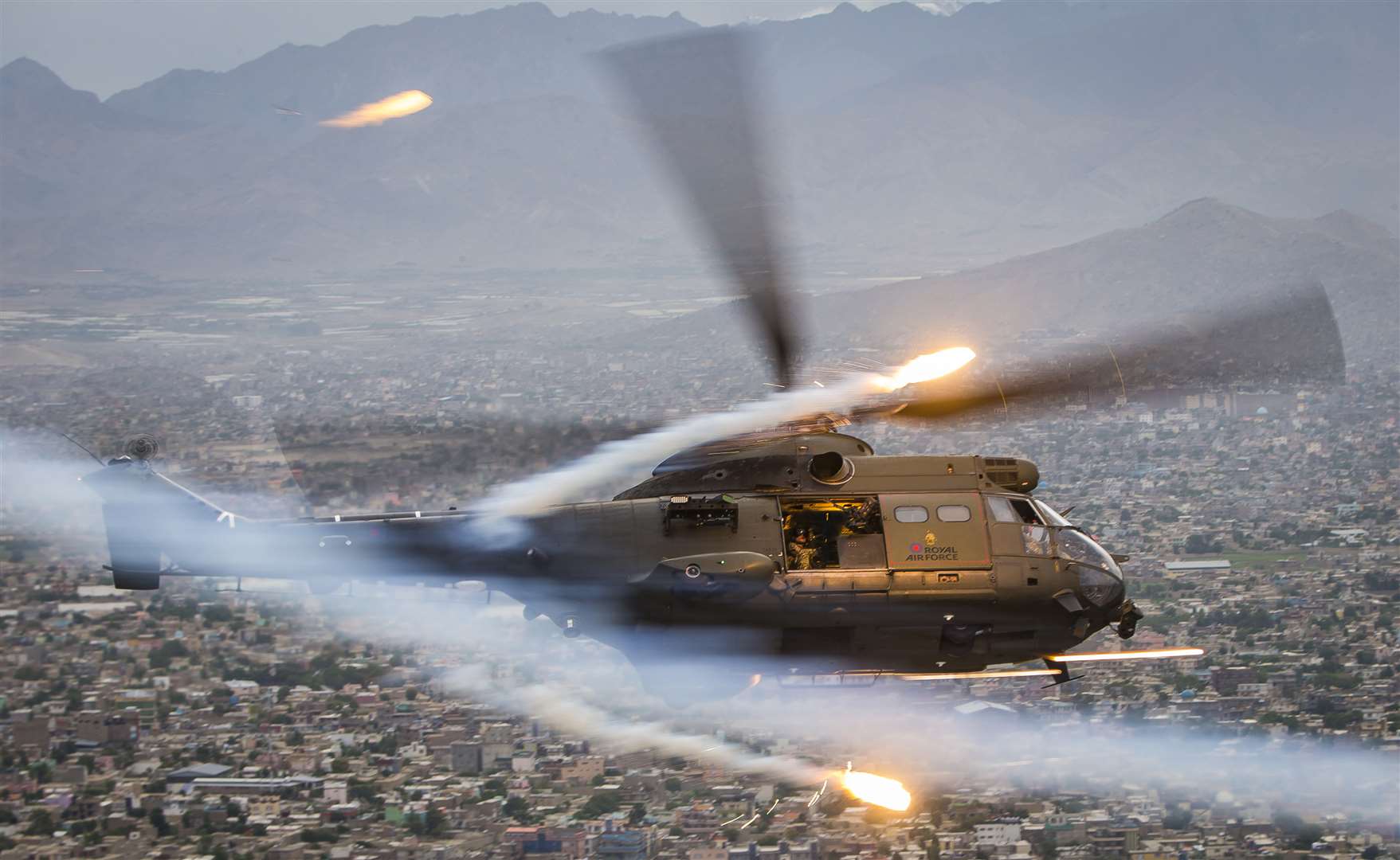 An RAF Puma HC2 flies over Kabul (Crown Copyright/PA)