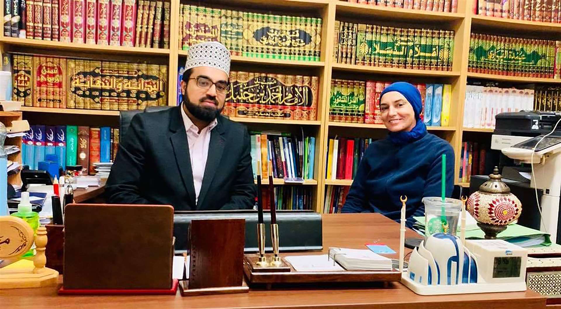 Shaykh Dr Umar Al-Qadri, an Islamic scholar and the chief Imam at the Islamic Centre of Ireland, and Sinead O’Connor at the Islamic Centre of Ireland (Shafqat Ayub/PA)