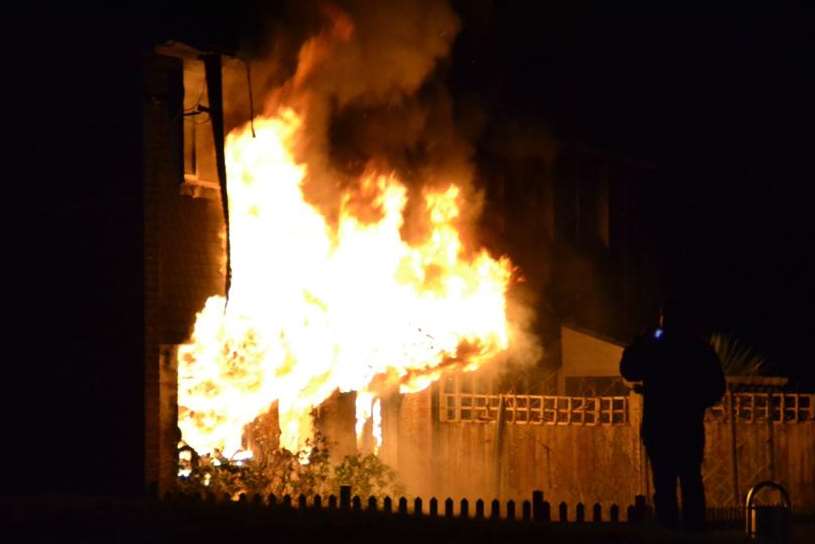 Flames pour from Mark and Rosemary Horton's house in Stanhope, Ashford