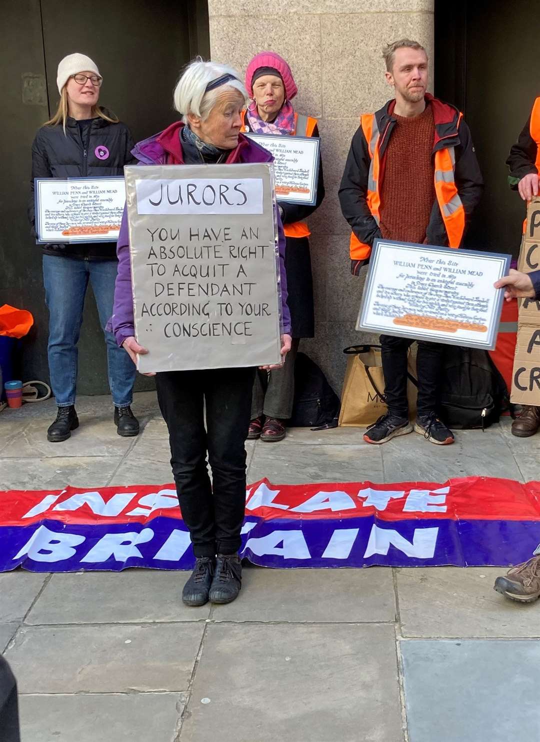 Trudi Warner and supporters holding up signs outside the Old Bailey in central London (Emily Pennink/PA)