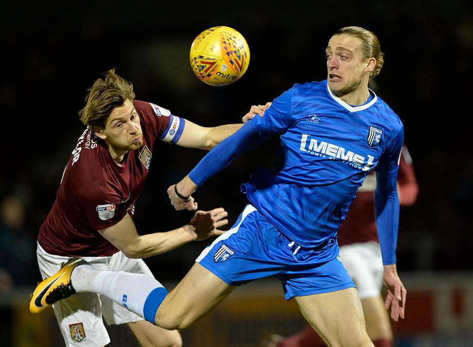 Tom Eaves battles with Northampton defender Ash Taylor Picture: Ady Kerry