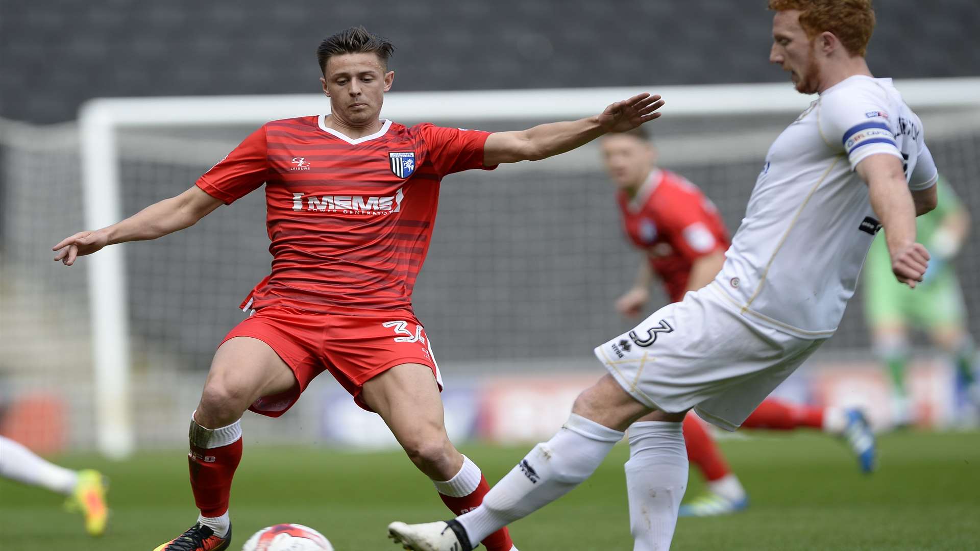 Harry Cornick and Dean Lewington get stuck in Picture: Ady Kerry