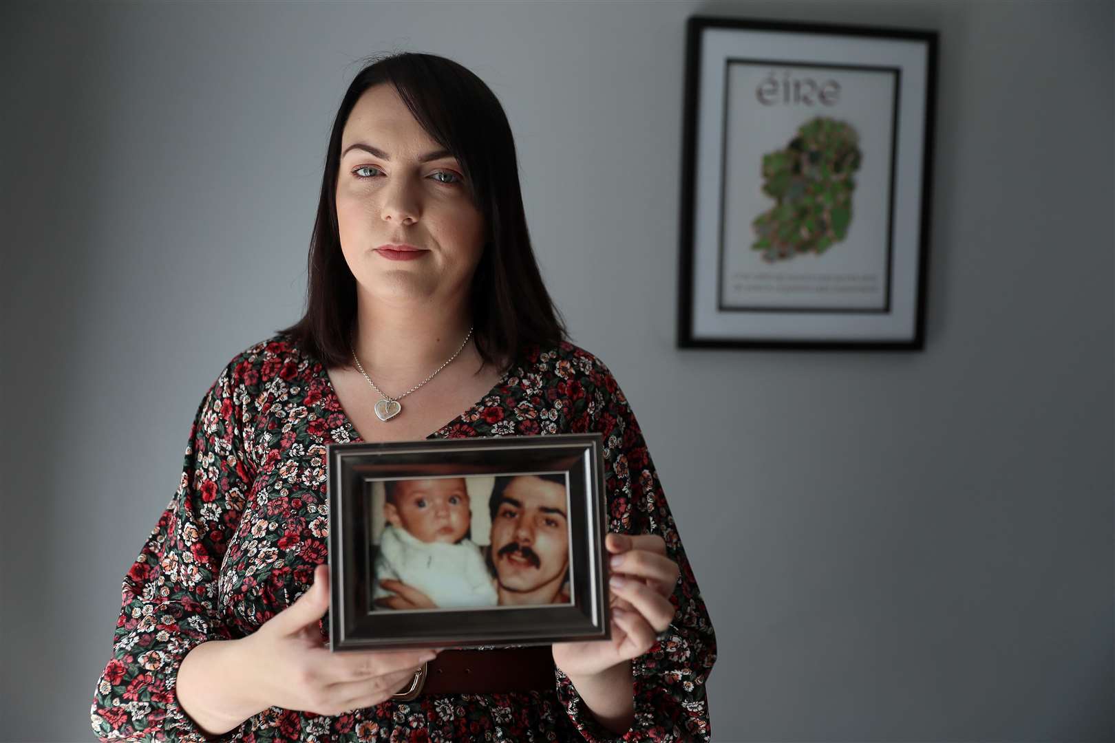 Charlene Smyth with a photo of herself as a baby with her father Charlie McGrillen, who was killed by the UFF in 1988 (Brian Lawless/PA)