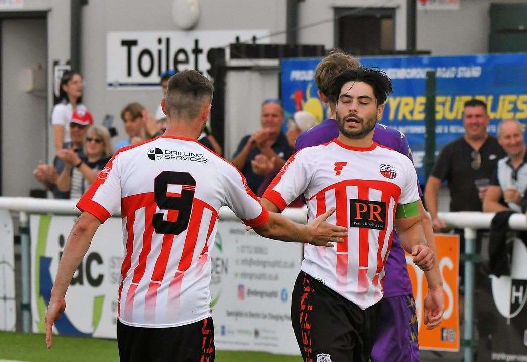 Sheppey skipper Richie Hamill is congratulated by team-mate Dan Bradshaw after converting his penalty Picture: Marc Richards