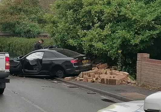 Police are at the scene of a crash in South Street, Meopham, after a car ploughed into a wall. Picture: Dave Dkb Barton