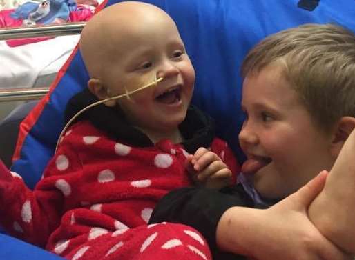 Ruby Young, two, playing her with brother Freddy, five, in hospital