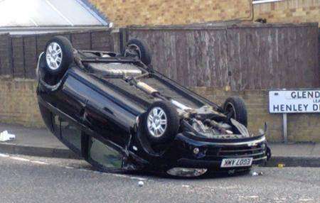 A car is flipped on its roof after a crash in Northfleet.