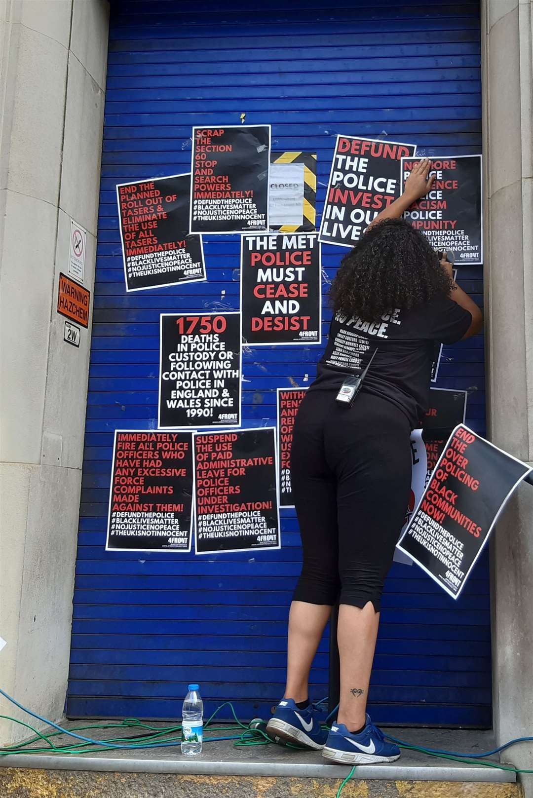 Protester pinned up posters on the doors to the police station (Helen William/PA)