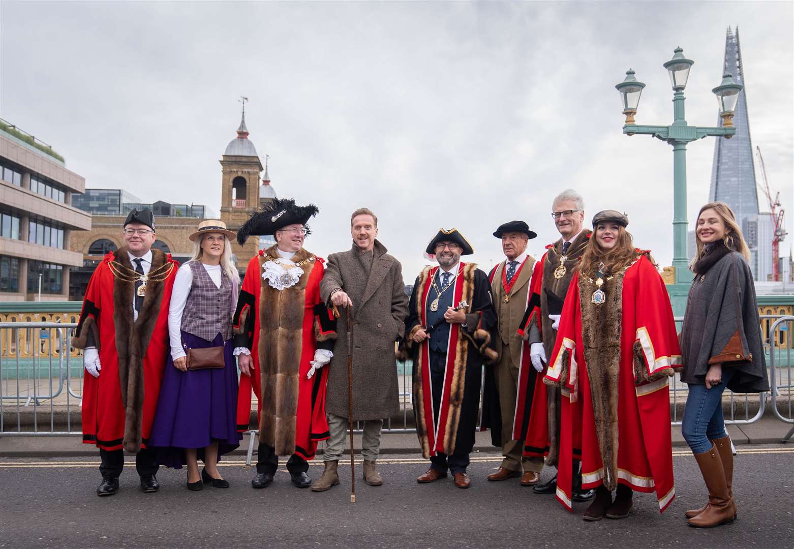 Damien Lewis (centre) poses with Freeman of the City and the Lord Mayor of London, Michael Mainelli (left of Lewis) ahead of driving sheep over Southwark Bridge, London (James Manning/PA)