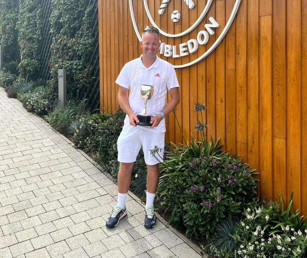 Zane Cheeseman with his over-40s singles title at the All England Club.