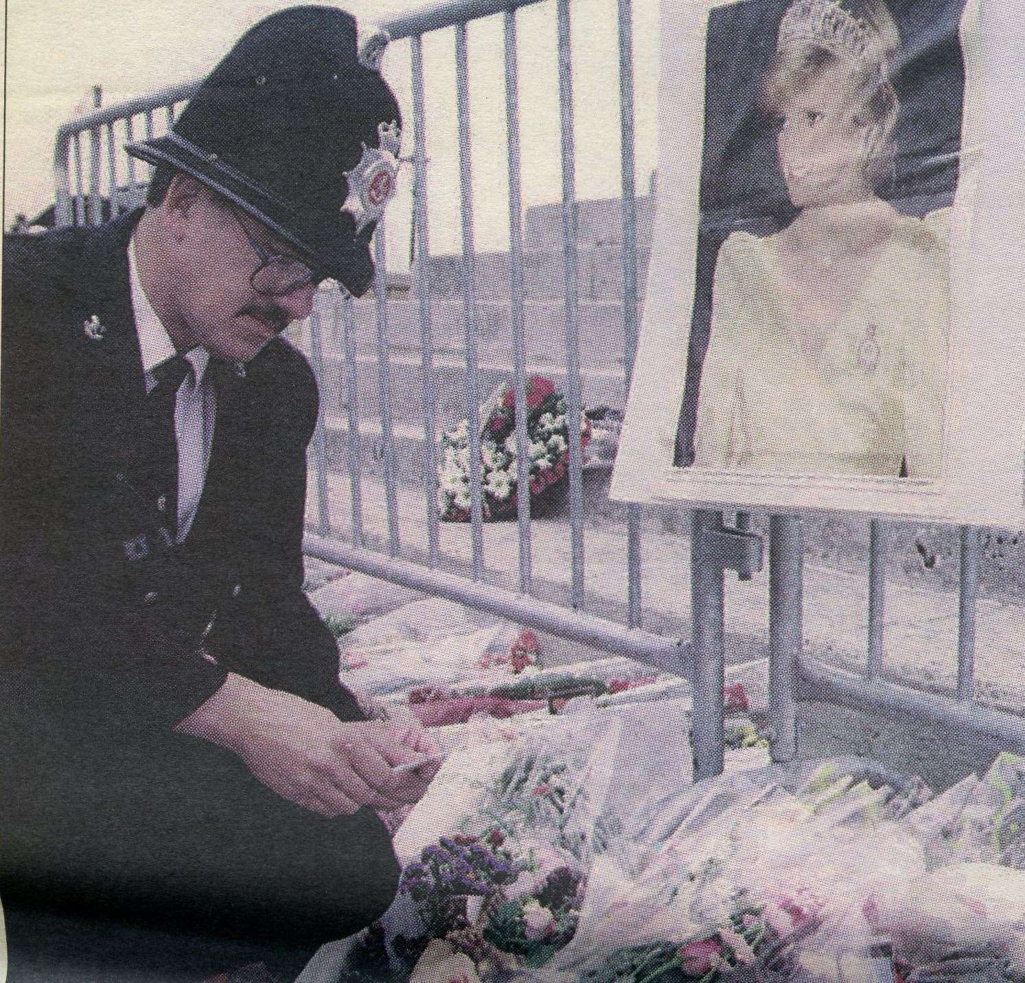 PC Webb reading tribute cards in Herne Bay. Picture: KMG