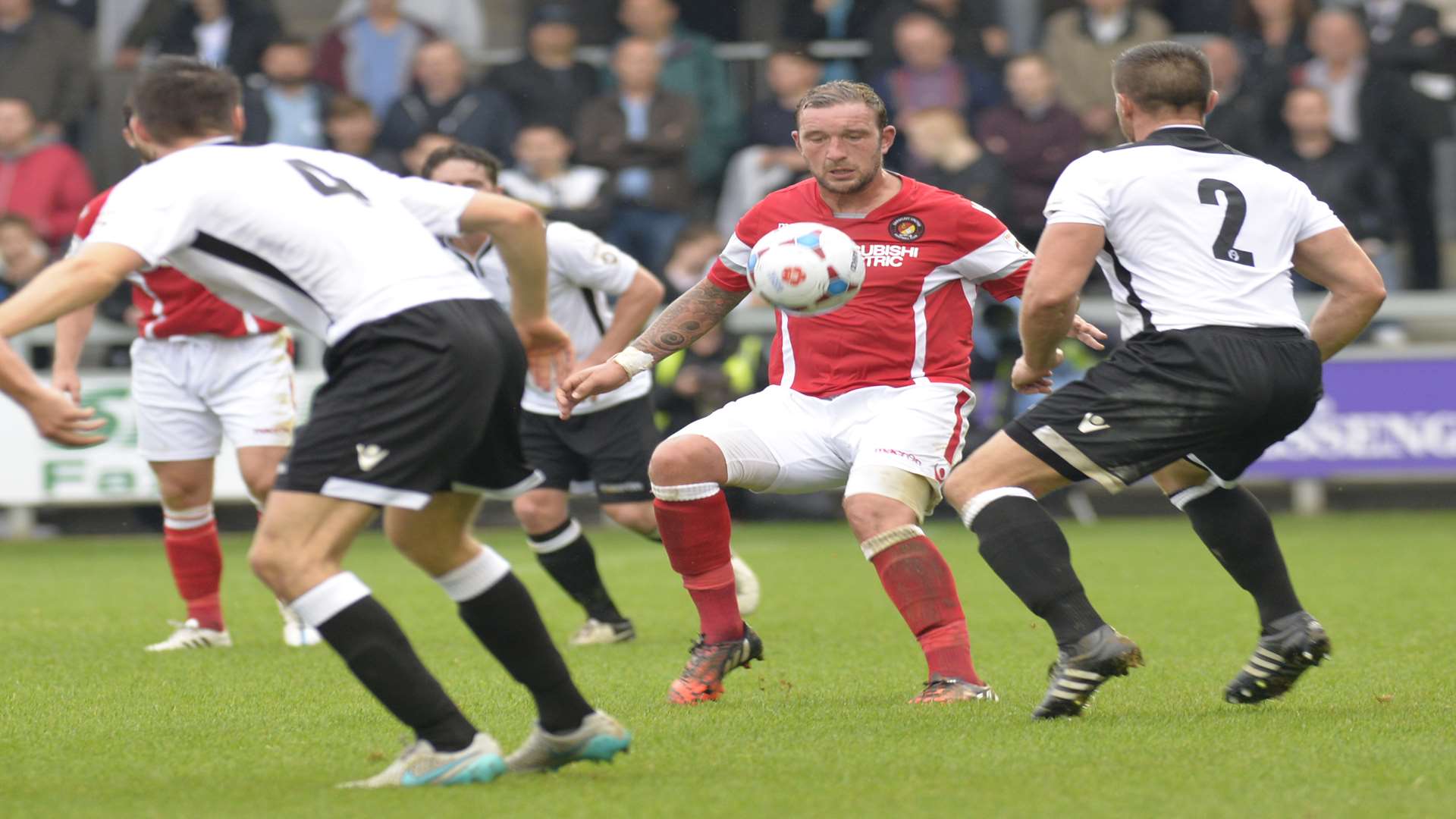 Danny Kedwell holds the ball up for Ebbsfleet under pressure from Lee Burns Picture: Ruth Cuerden