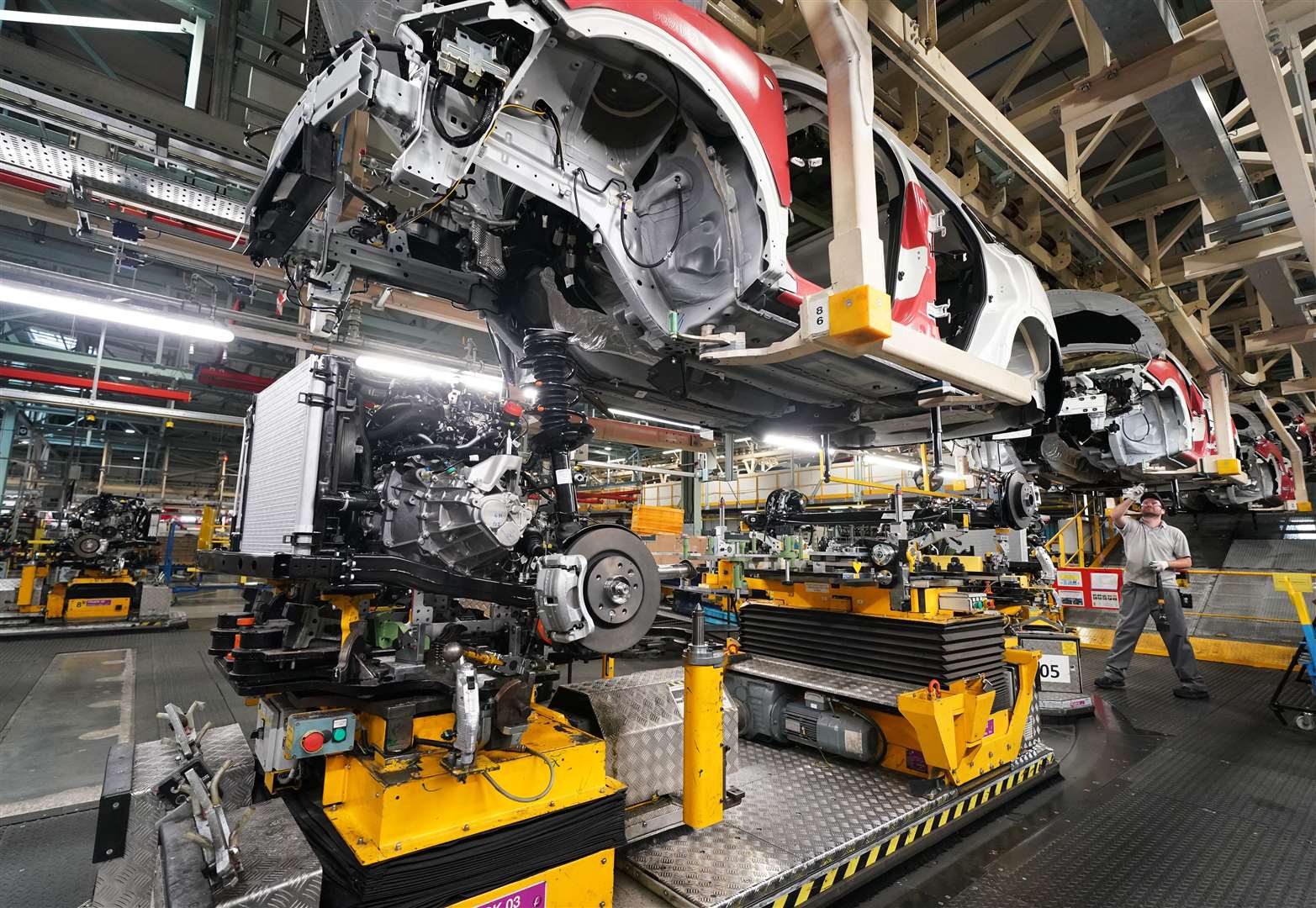 Workers on the production line at Nissan’s factory in Sunderland (Owen Humphreys/PA)