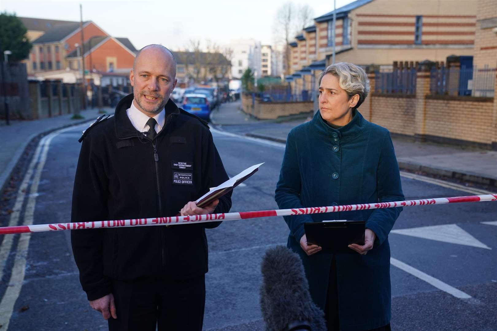 Metropolitan Police Detective Chief Superintendent James Conway and Hackney mayor Caroline Woodley issue a statement near to the scene in Vine Close, Hackney, on Wednesday (Lucy North/PA)