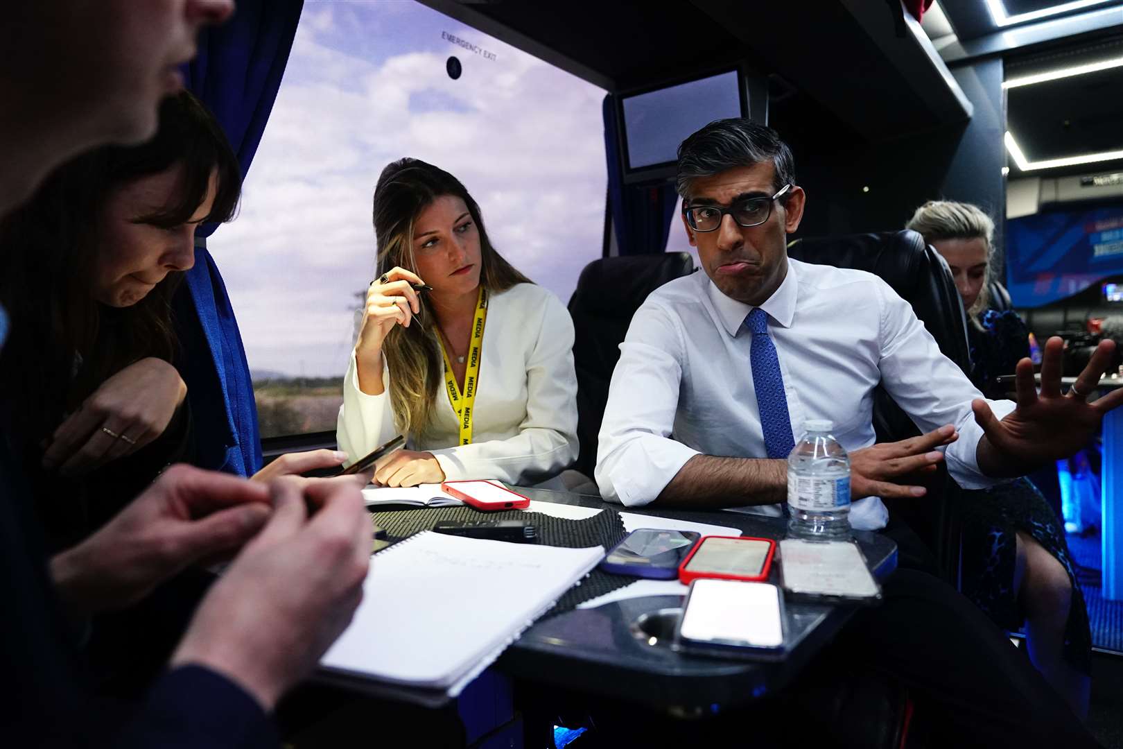 Prime Minister Rishi Sunak talks to journalists on board his campaign battle bus during the election campaign (Aaron Chown/PA)