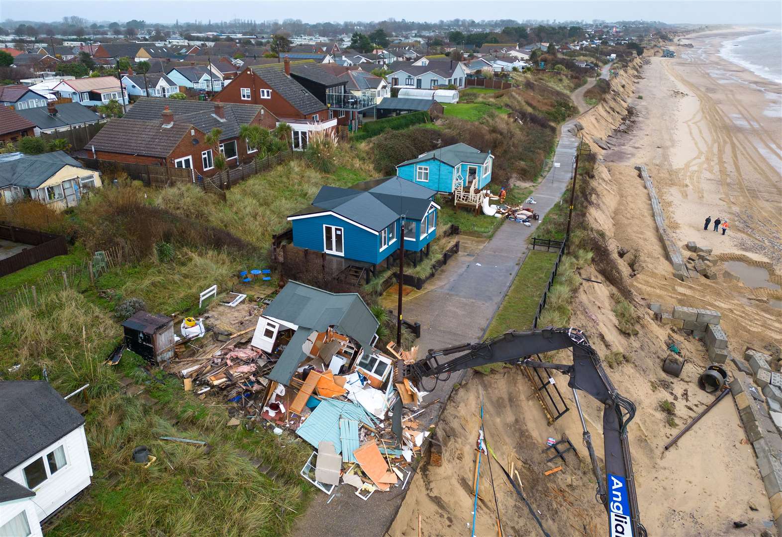 Material is being taken off the beach by tipper truck (Joe Giddens/PA)