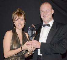 Dawn Cutler and Paul West of Minimise celebrate their firm's triumph in the Medway Business Awards