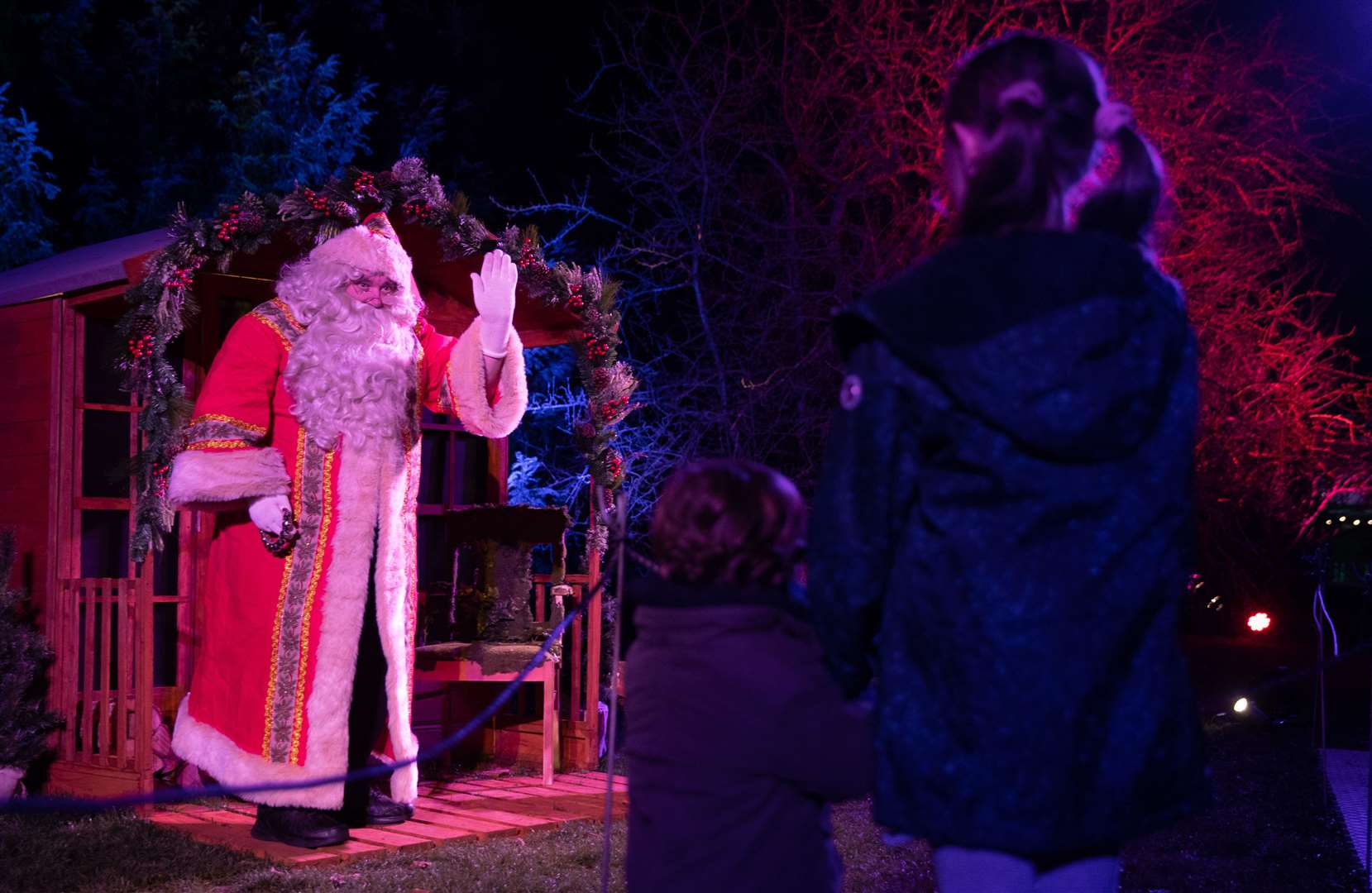 Alfred Alejandro Dudely-Mira and Lulu Kingstone meet Father Christmas at his grotto (Andrew Matthews/PA)