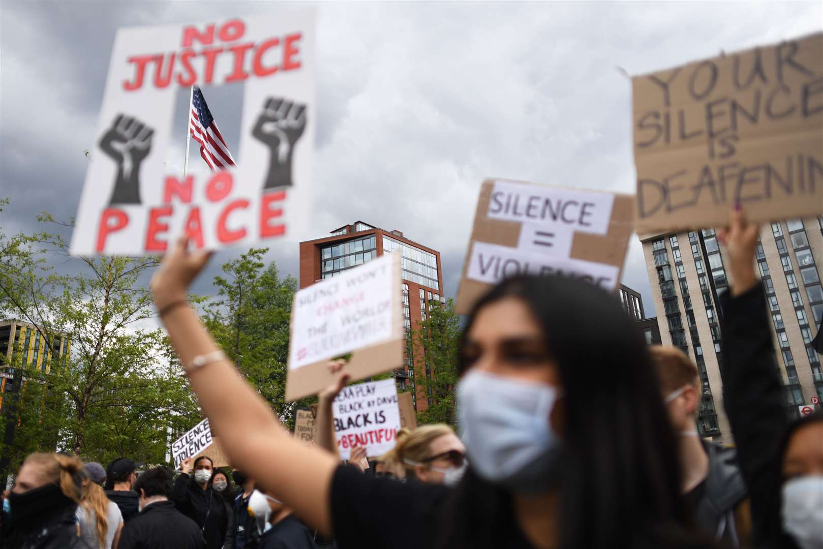 People take part in a Black Lives Matter protest rally at the US Embassy, London (Stefan Rousseau/PA)