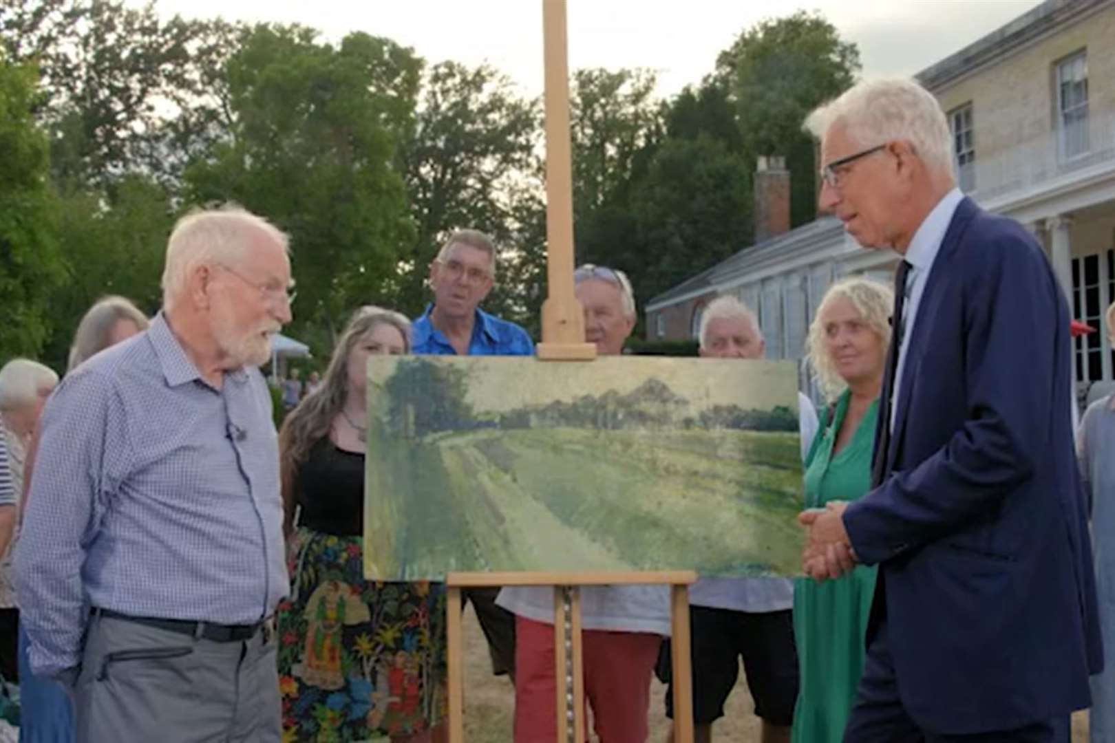 The owner (left) and Rupert Maas discuss the rediscovered artwork. Picture: BBC/Antiques Roadshow