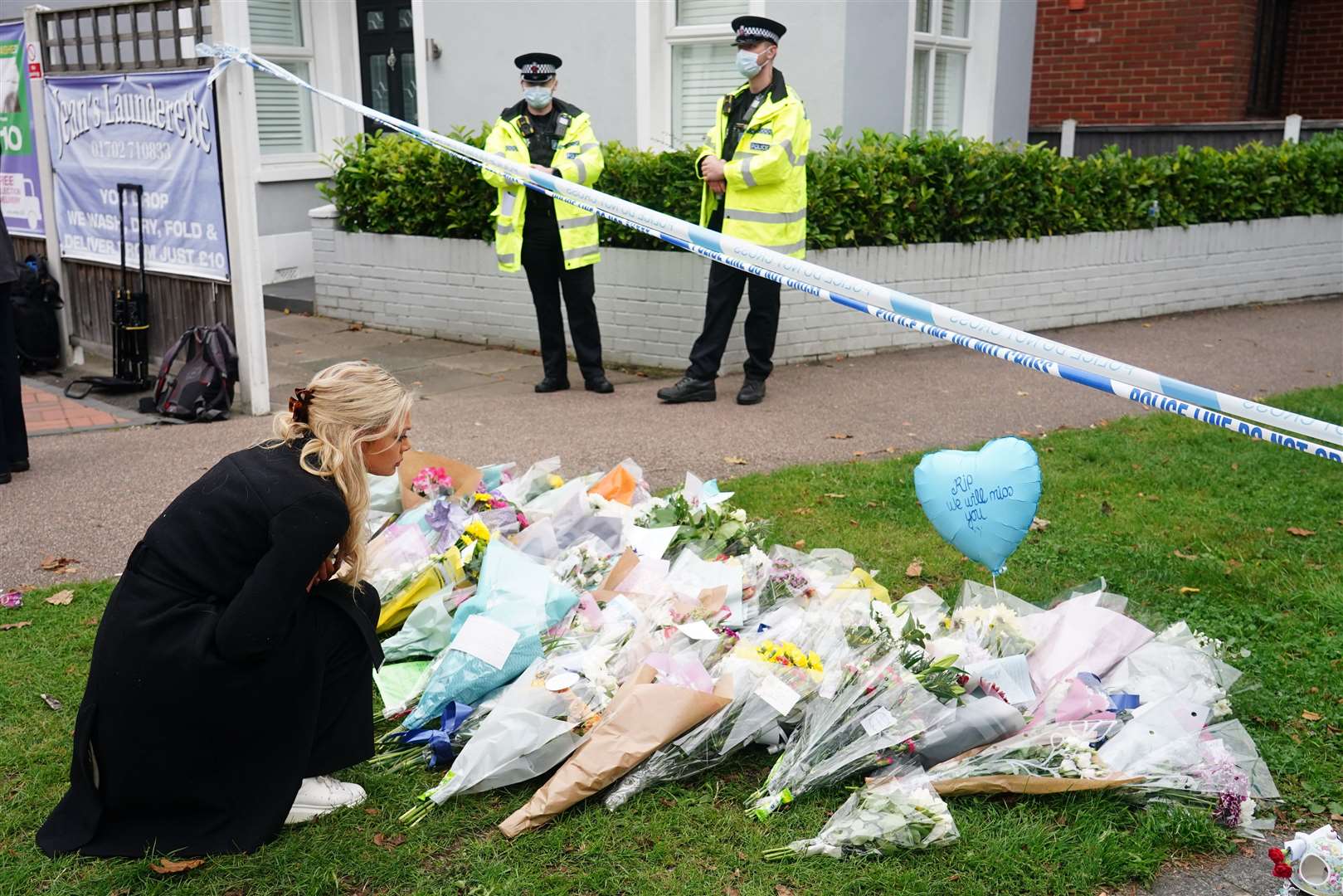 People leave flowers at the scene near Belfairs Methodist Church (Dominic Lipinski/PA)